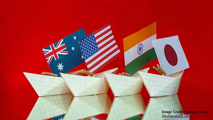 Flags of the quad countries on paper boats